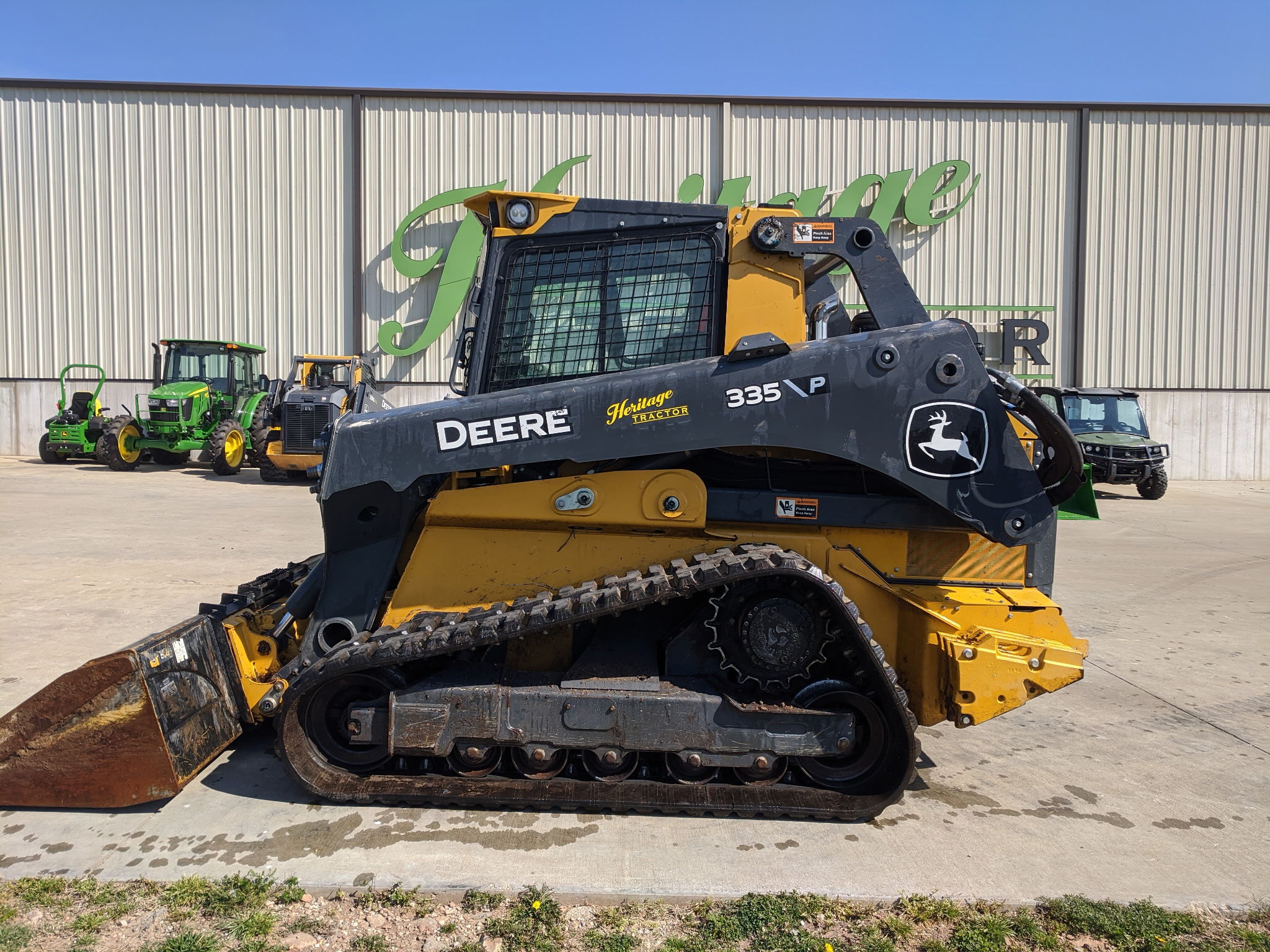  2025 John Deere 335 P at Heritage Tractor in Rogersville, MO