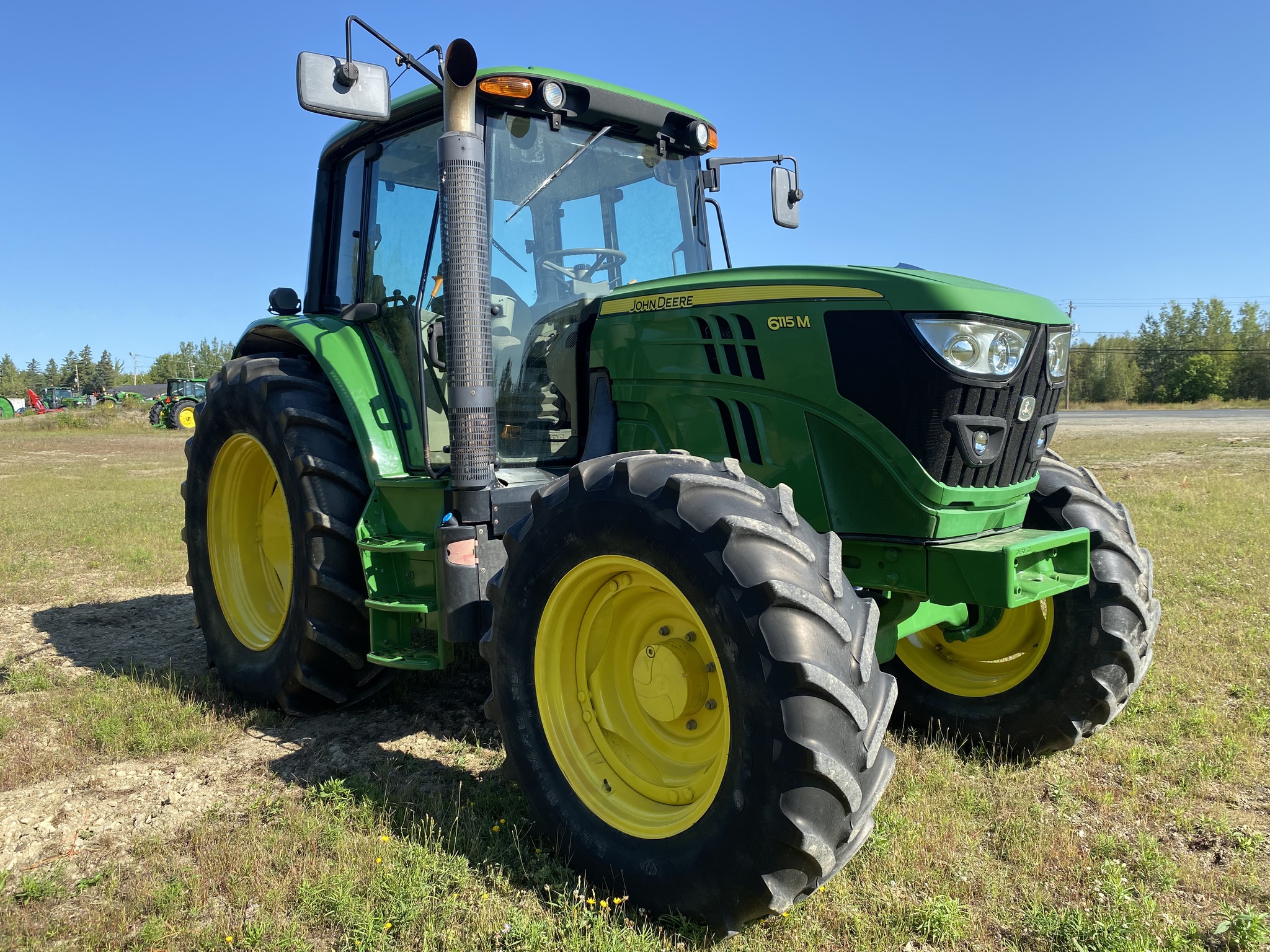 2015 John Deere 6115M Image 1
