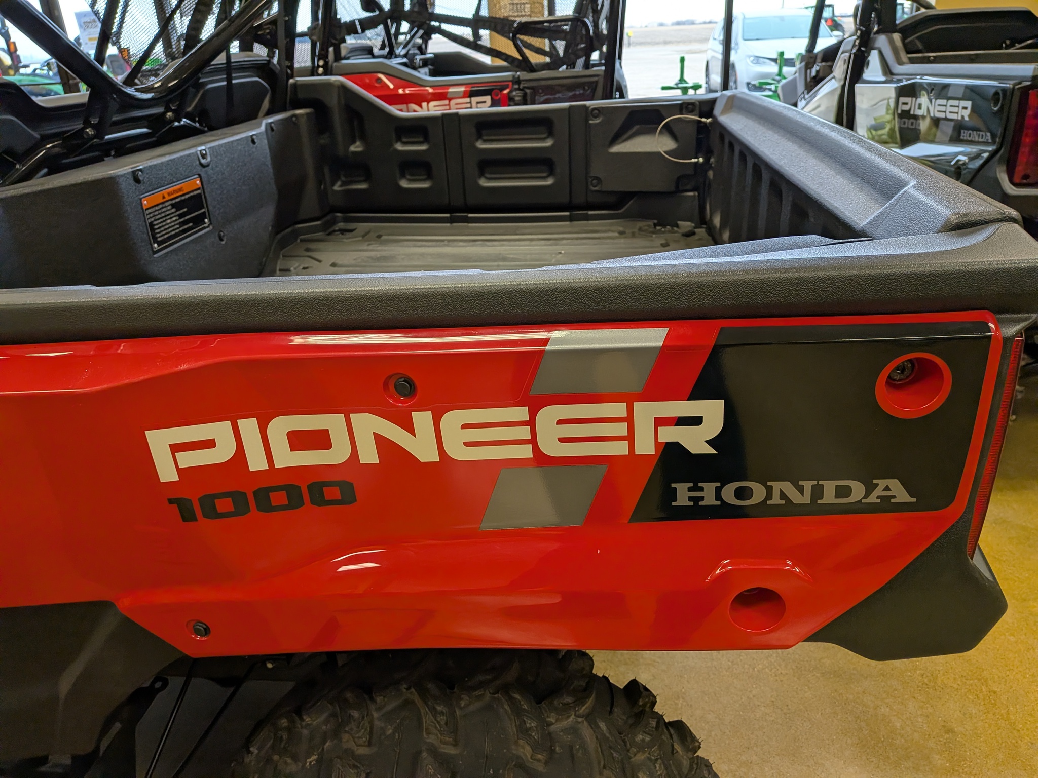  2025 Honda SXS10M6DS RED PIONEER at Heritage Tractor in Galesburg, IL