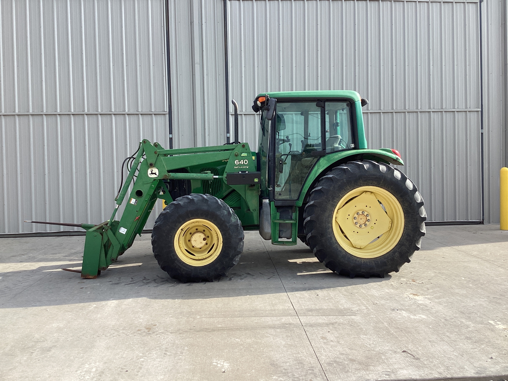 2002 John Deere 6320 Image 1