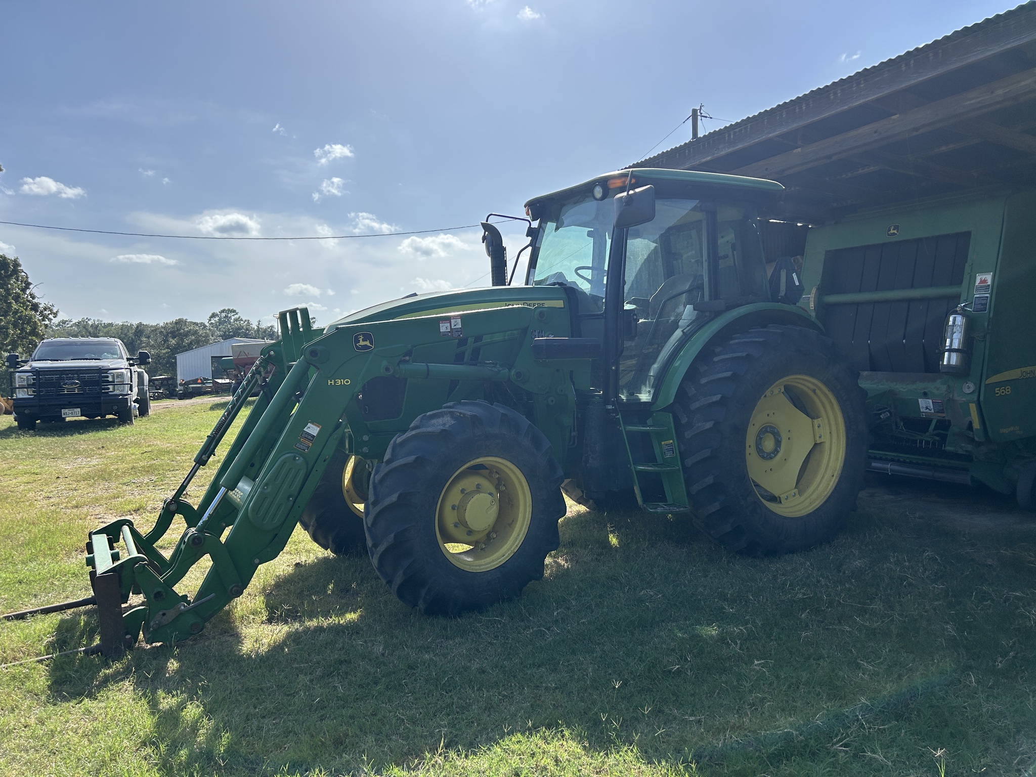 2015 John Deere 6115D Image 1