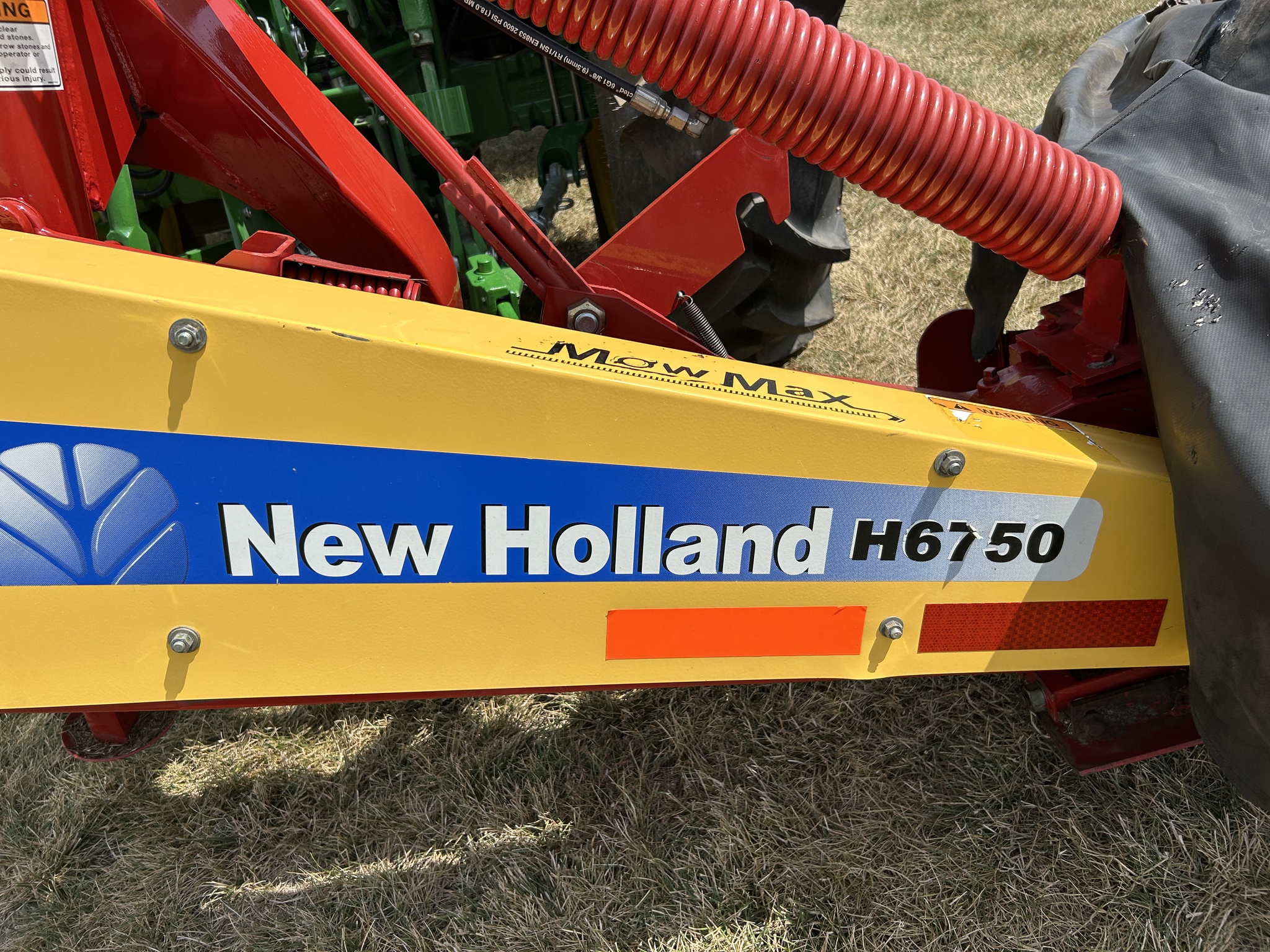  2013 New Holland H6750 at Heritage Tractor in Adrian, MO