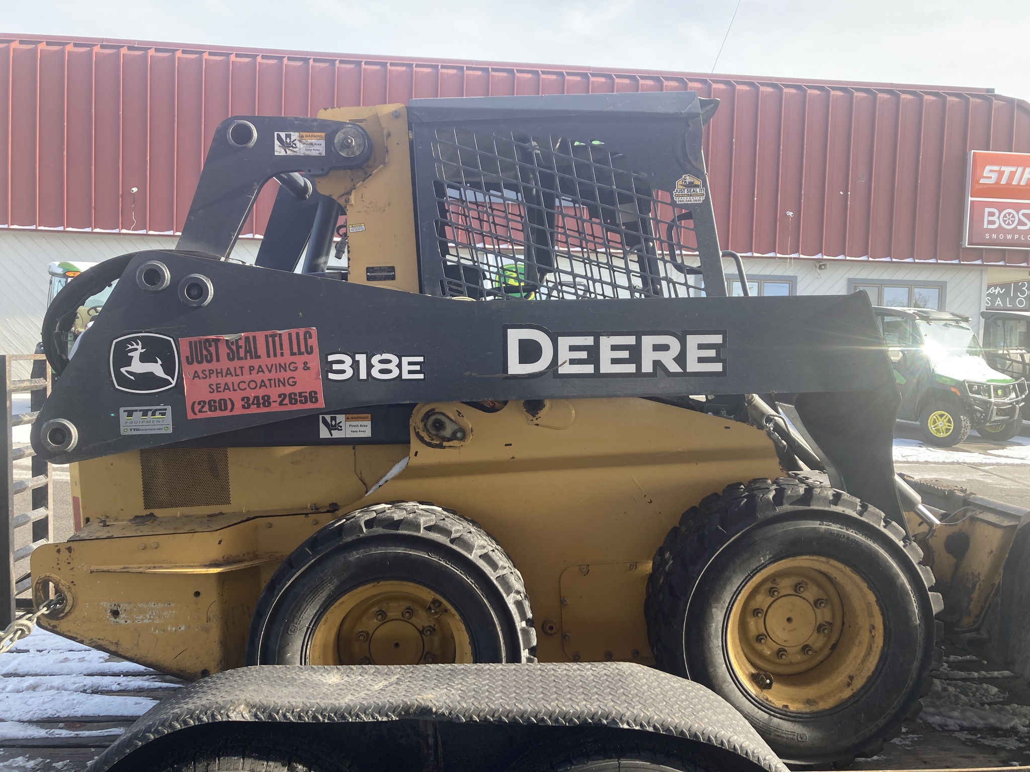 2014 John Deere 318E Image 1