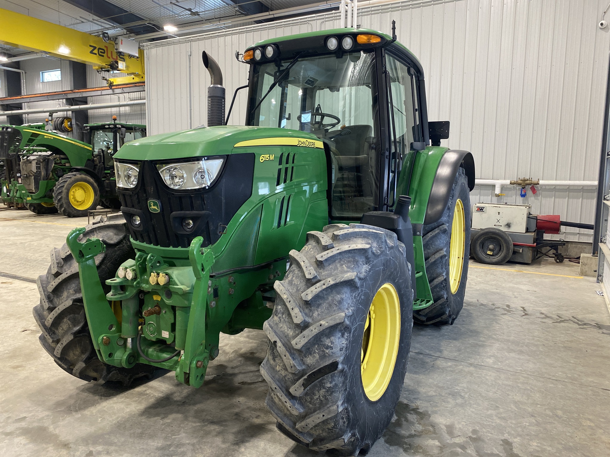 2015 John Deere 6115M Image 1